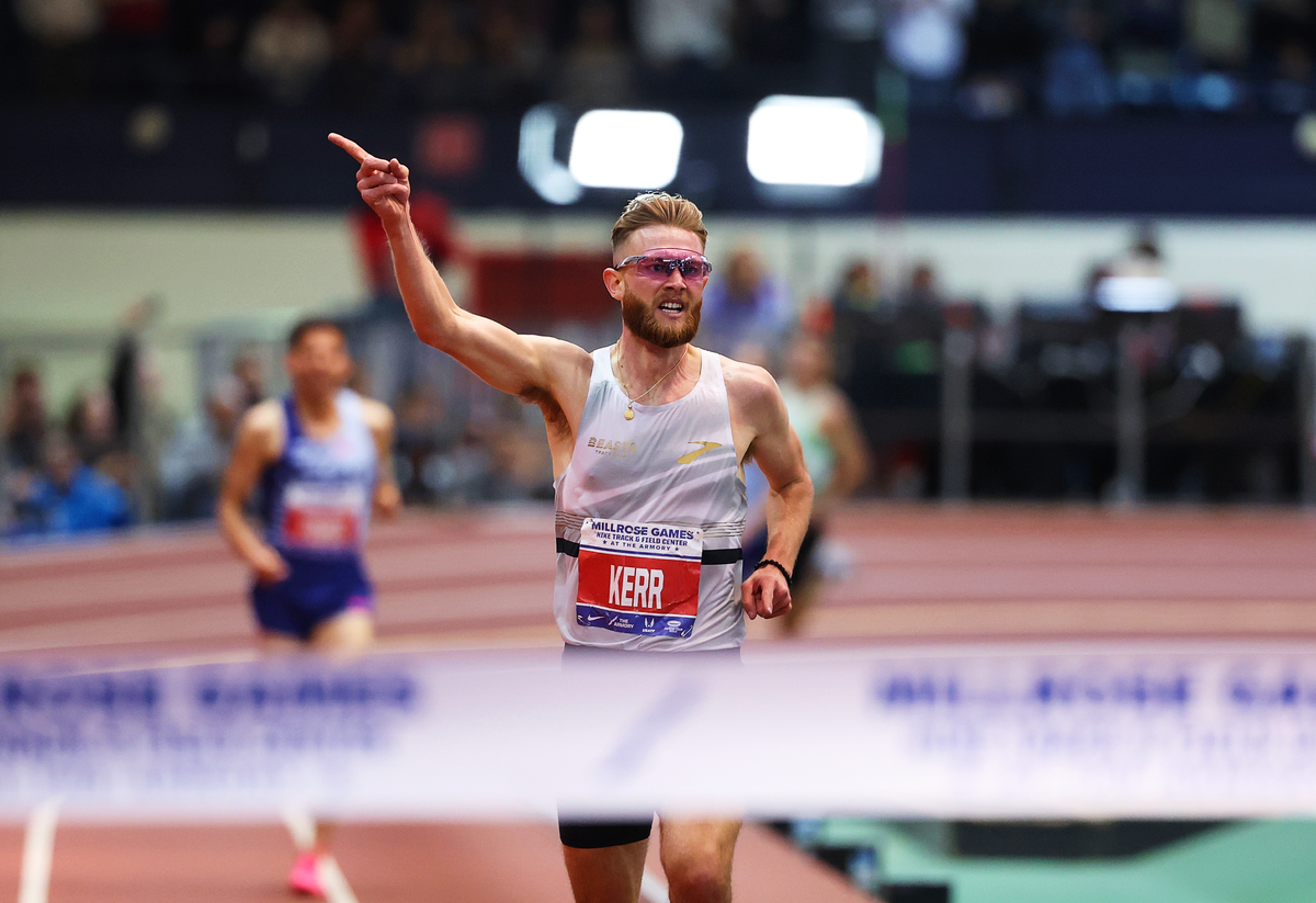 Josh Kerr celebrates as he prepares to clinch the indoor two-mile world record in New York on 11 February  (Getty)