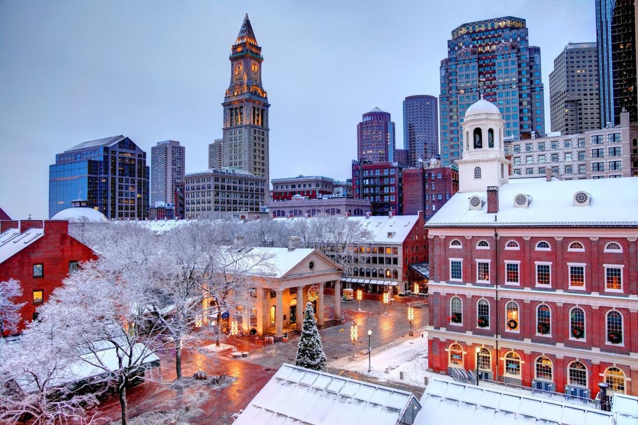 faneuil hall rooftops covered in snow during the winter season in boston faneuil hall also known as quincy market is located near the waterfront and government center, in boston, massachusetts, has been a marketplace and a meeting hall since 1743 boston is the largest city in new england, the capital of the commonwealth of massachusetts
