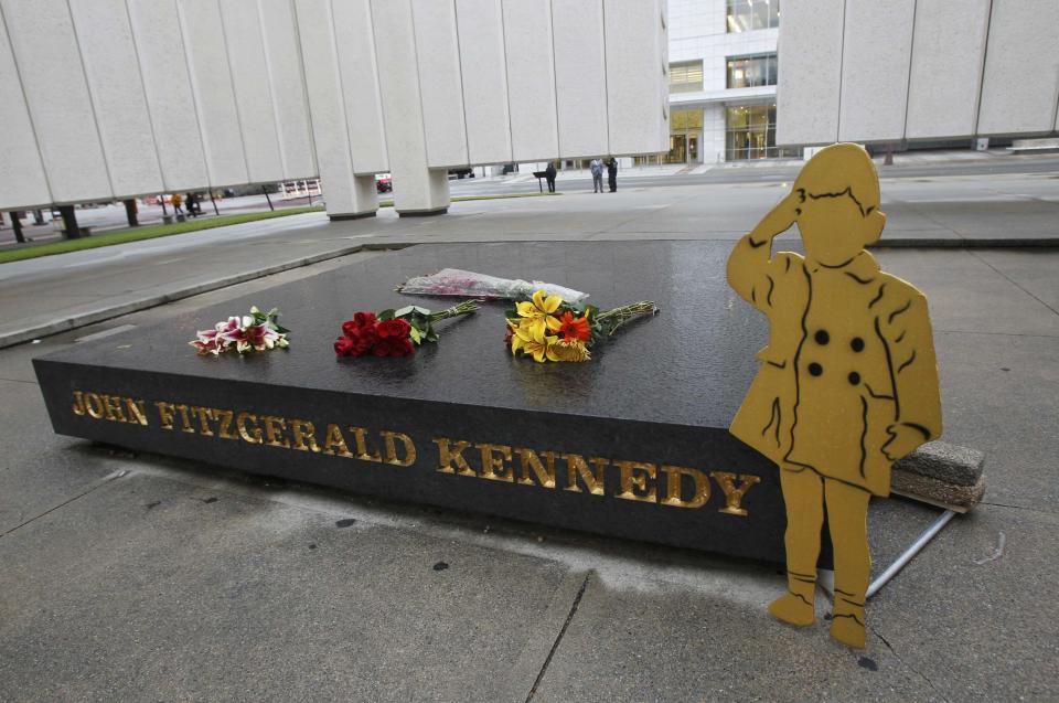 A silhouette of JFK Jr. saluting his father's casket at President Kennedy's state funeral is seen at John F. Kennedy Memorial Plaza in Dallas