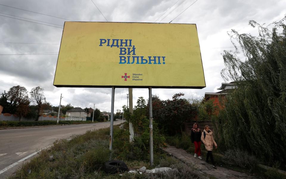 A billboard reading 'Citizens you are free' is posted by Ukrainian forces in the newly liberated city of Kupiansk, east of Kharkiv - ATEF SAFADI/EPA-EFE/Shutterstock