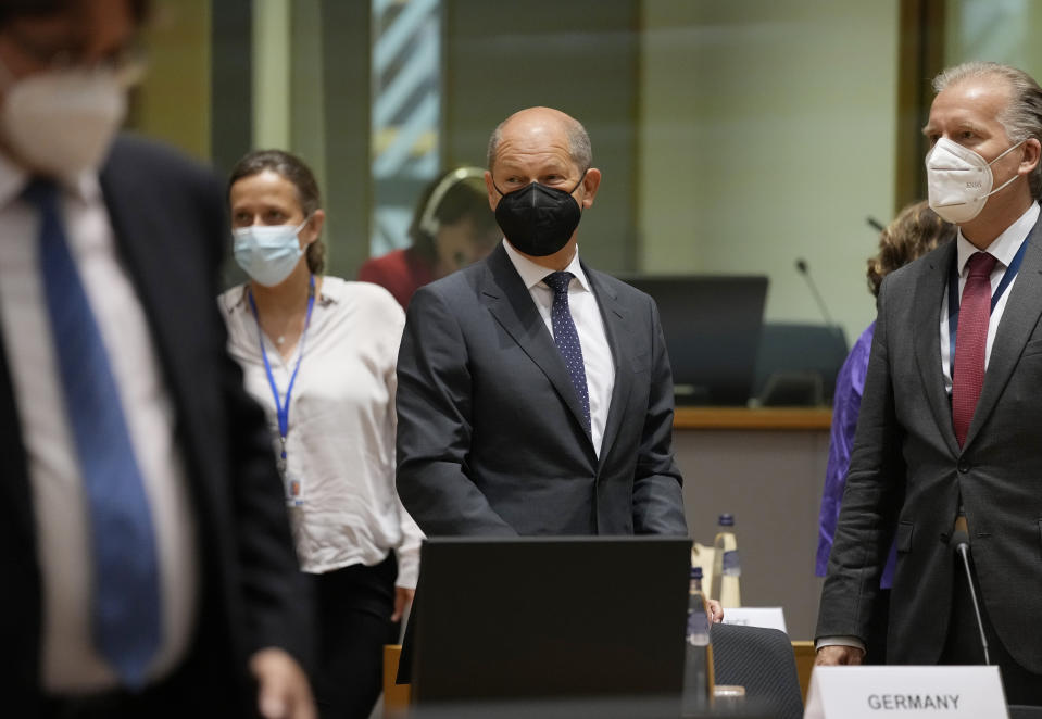 German Finance Minister Olaf Scholz, center, attends a meeting of the eurogroup finance ministers at the European Council building in Brussels on Monday, July 12, 2021. (AP Photo/Virginia Mayo)