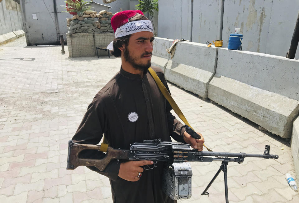 A Taliban fighter stands guard at a checkpoint near the US embassy that was previously manned by American troops, in Kabul, Afghanistan, Tuesday, Aug. 17, 2021. The Taliban declared an "amnesty" across Afghanistan and urged women to join their government Tuesday, seeking to convince a wary population that they have changed a day after deadly chaos gripped the main airport as desperate crowds tried to flee the country. (AP Photo)