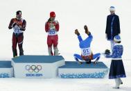 RNPS YEAR END 2014 - BEST OF SPORT ODDLY Third-placed Italy's Christof Innerhofer (2nd R) does a somersault on the podium as winner Switzerland's Sandro Viletta (2nd L) and second-placed Croatia's Ivica Kostelic (L) laugh after the men's alpine skiing super combined event at the 2014 Sochi Winter Olympics at the Rosa Khutor Alpine Center in this February 14, 2014 file photo. REUTERS/Stefano Rellandini/Files (RUSSIA - Tags: SPORT SKIING OLYMPICS TPX IMAGES OF THE DAY)