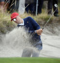 USA's Justin Thomas hits out of a bunker during a practice session ahead of the President's Cup Golf tournament in Melbourne, Tuesday, Dec. 10, 2019. (AP Photo/Andy Brownbill)