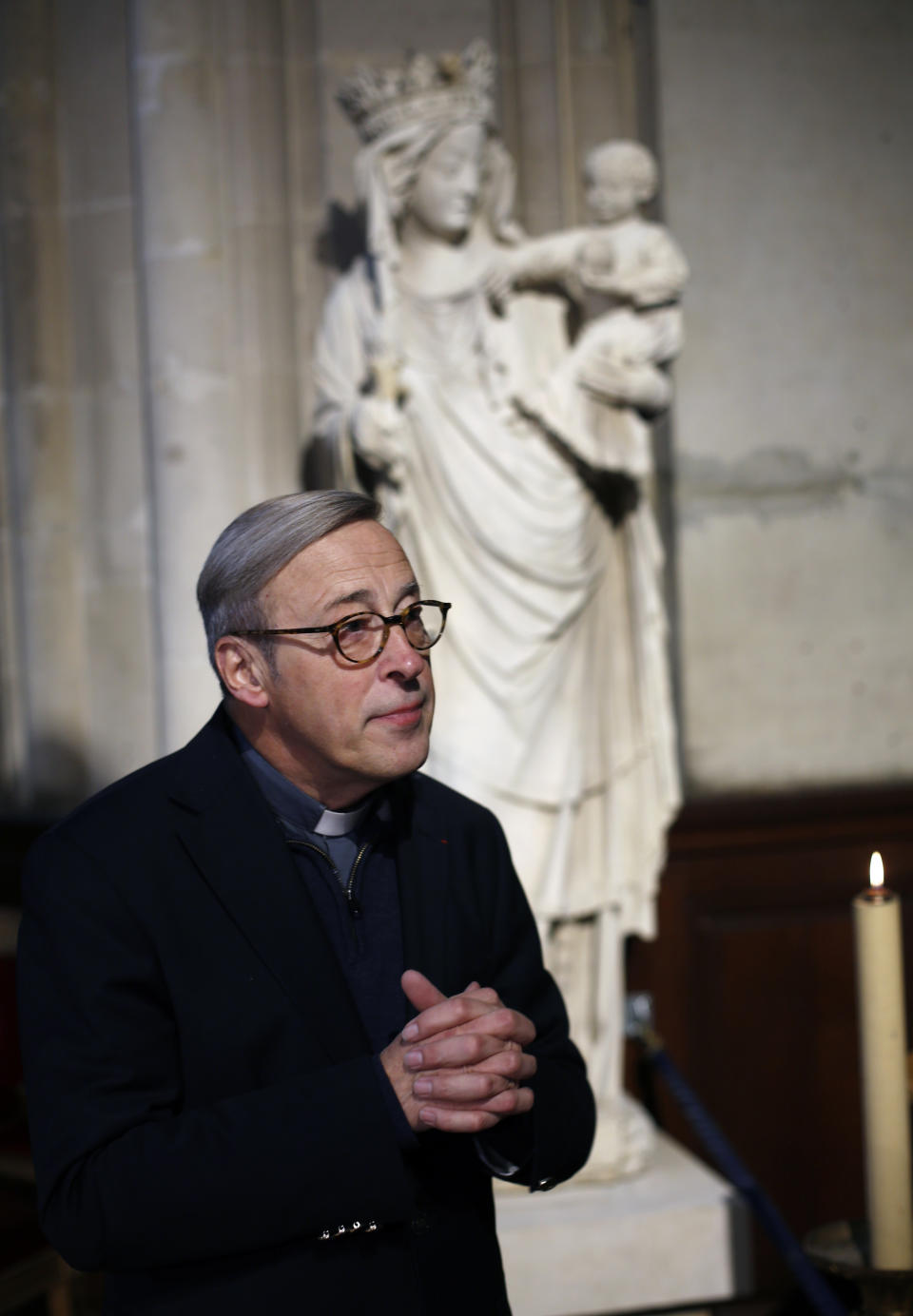 In this photo taken on Tuesday Dec. 3, 2019, Notre Dame cathedral rector Patrick Chauvet talks to the Associated Press, in Saint-Germain l'Auxerrois church, in Paris. Notre Dame Cathedral kept holding services during two world wars as a beacon of hope amid bloodshed and fear. It took a fire in peacetime to finally stop Notre Dame from celebrating Christmas Mass for the first time in more than two centuries. (AP Photo/Thibault Camus)