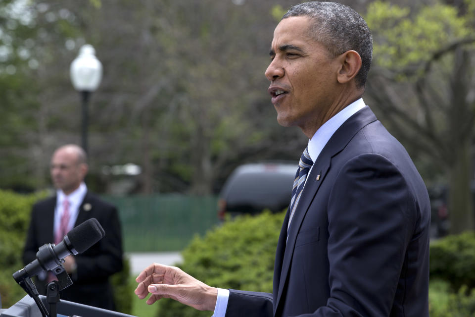 President Barack Obama speaks in the Rose Garden of the White House in Washington, Friday, April 18, 2014, where he presented the Commander-in-Chief's Trophy to the United States Naval Academy football team. The Obama administration is extending indefinitely the amount of time federal agencies have to review the Keystone XL pipeline, the State Department said Friday, likely punting the decision over the controversial oil pipeline past the midterm elections. (AP Photo/Jacquelyn Martin)