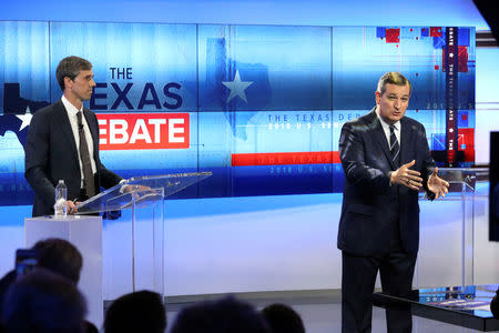 FILE PHOTO: U.S. Senator Ted Cruz (R) speaks as U.S. Rep. Beto O'Rourke looks on, during a debate at the KENS-5 Studios in San Antonio, Texas, Oct. 16, 2018. Tom Reel/San Antonio Express-News/Pool via REUTERS/File Photo