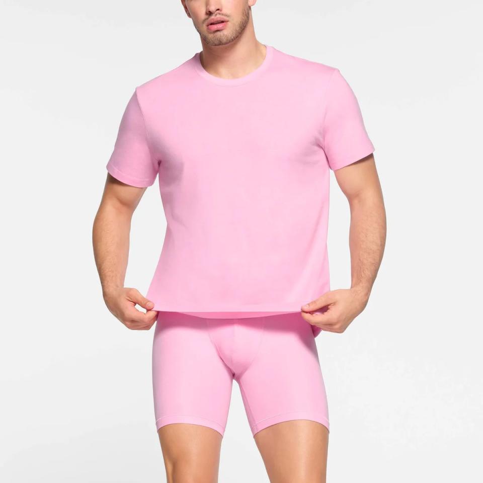 model wearing pink cotton t-shirt with matching boxer briefs