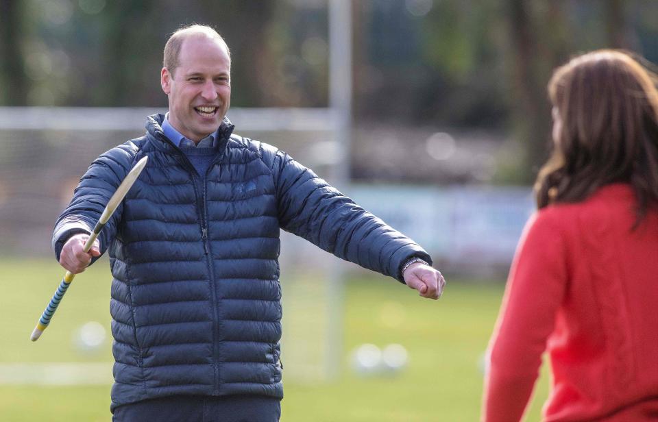 Britain's Prince William, Duke of Cambridge (L) and Britain's Catherine, Duchess of Cambridge react as they attempt to play hurling during a visit to Salthill Gaelic Athletic Association (GAA) club in Galway, western Ireland, on March 5, 2020 on the final day of their three day visit. (Photo by Paul Faith / AFP) (Photo by PAUL FAITH/AFP via Getty Images)