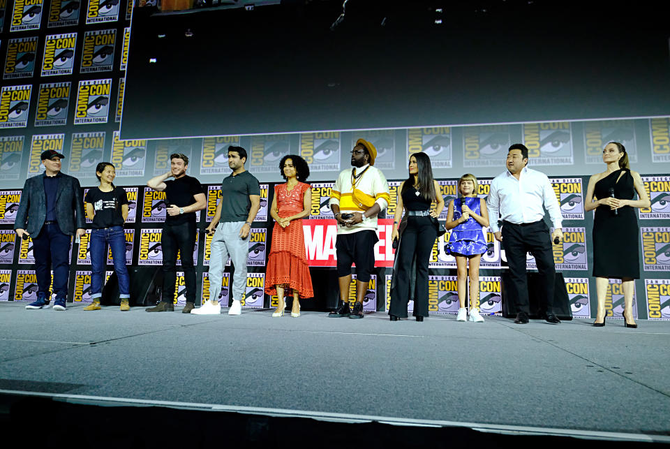 SAN DIEGO, CALIFORNIA - JULY 20: (L-R) President of Marvel Studios Kevin Feige, director Chloe Zhao, Richard Madden, Kumail Nanjiani, Lauren Ridloff, Brian Tyree Henry, Salma Hayek, Lia McHugh, Don Lee and Angelina Jolie of Marvel Studios' 'The Eternals' at the San Diego Comic-Con International 2019 Marvel Studios Panel in Hall H on July 20, 2019 in San Diego, California. (Photo by Alberto E. Rodriguez/Getty Images for Disney)