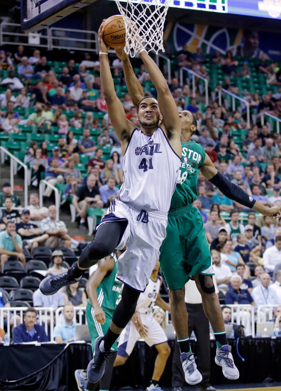 Utah Jazz's Trey Lyles (41) drives to the basket as Boston Celtics' Malcolm Miller (48) defends during the second half of an NBA summer league basketball game Tuesday, July 5, 2016, in Salt Lake City. (AP Photo/Rick Bowmer)