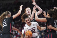 South Carolina guard Brea Beal (12) is defended by Stanford's Hannah Jump (33), Ashten Prechtel (11) and Haley Jones (30) during the first half of an NCAA college basketball game Tuesday, Dec. 21, 2021, in Columbia, S.C. (AP Photo/Sean Rayford)