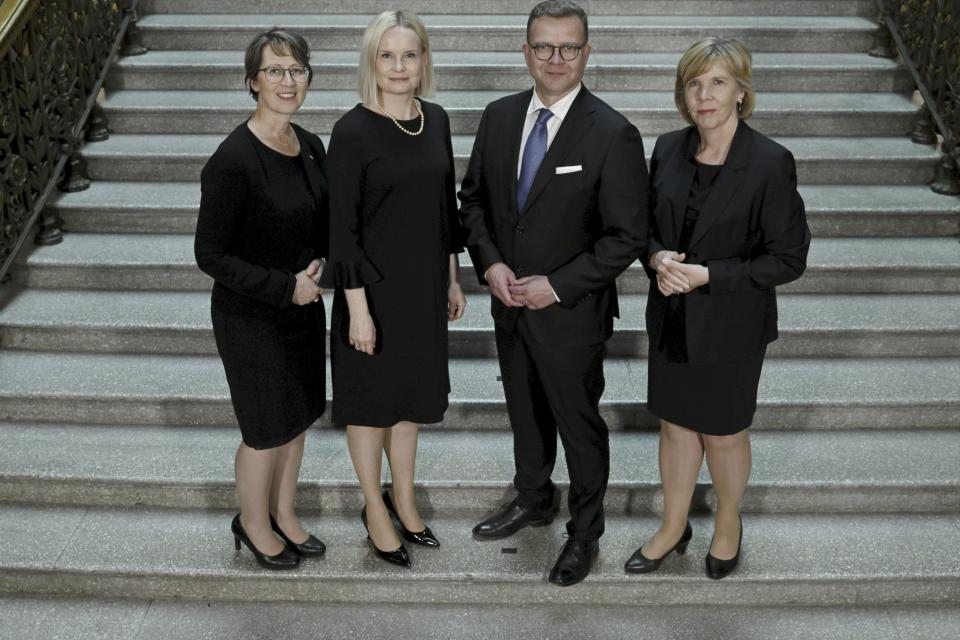 The new Government of Finland the right-wing coalition led by National Coalition Party chair Prime Minister Petteri Orpo, 2nd right, and Finns Party chair, Minister of Finance Riikka Purra, 2nd left, Swedish People's Party chair, Minister of Education Anna-Maja Henriksson, right, and Christian Democrats chair, Minister of Agriculture and Forestry Sari Essayah, left, pose for a family picture in Helsinki, Tuesday, June 20, 2023. (Antti Aimo-Koivisto/Lehtikuva via AP)