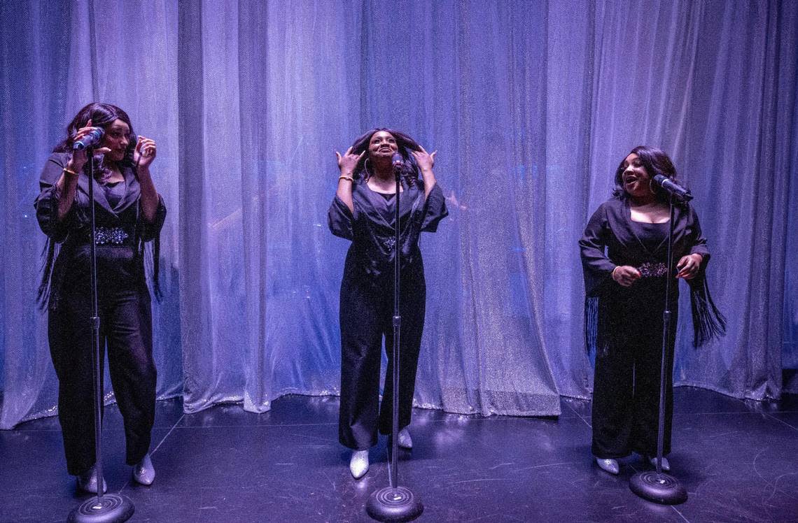 Alyssa Byers, from left, Cherise Coaches and Jessica Brooke Seals prepare for the curtain to open where they perform as “The Sweet Inspirations,” during “Elvis: Aloha from Vegas” show.