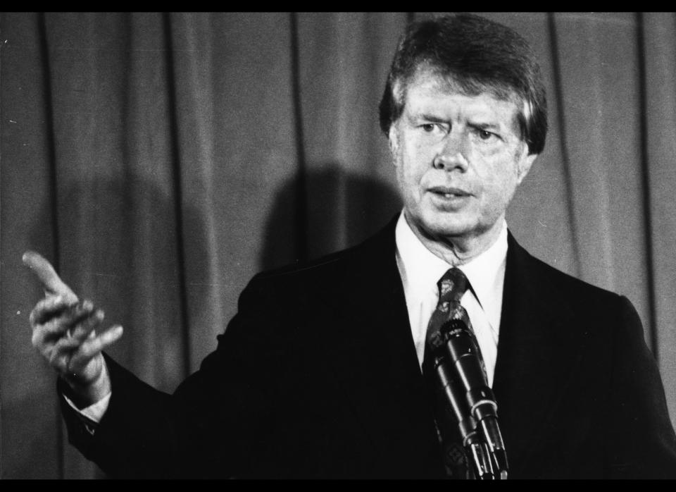 President Jimmy Carter pushes a mandatory national health plan, but economic recession helps push it aside. (Photo by Central Press/Getty Images)  