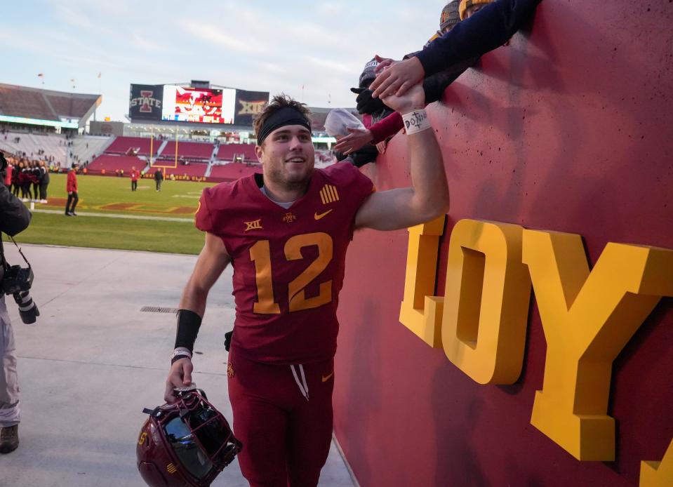 Iowa State quarterback Hunter Dekkers greets fans after leading the Cyclones to a 31-14 win over West Virginia at Jack Trice Stadium in Ames on Nov. 5, 2022.