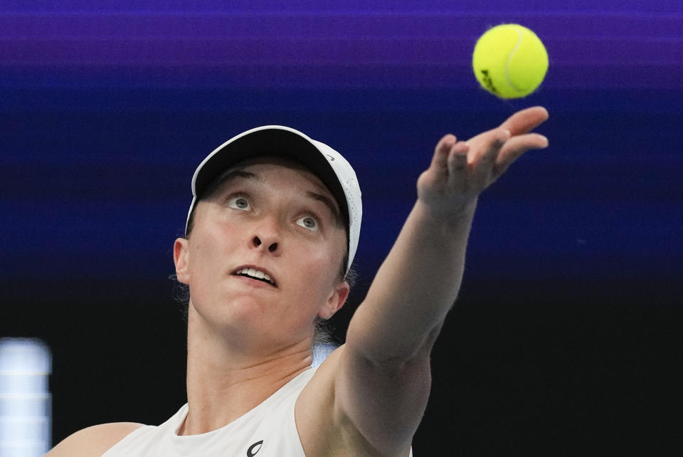 FILE - Poland's Iga Swiatek serves to Germany's Angelique Kerber during the final of the United Cup in Sydney, Australia, Sunday, Jan. 7, 2024. Swiatek is one of the players to watch at the Australian Open. The year's first Grand Slam tennis tournament is scheduled to start at Melbourne Park on Sunday, Jan. 14. (AP Photo/Mark Baker, File)