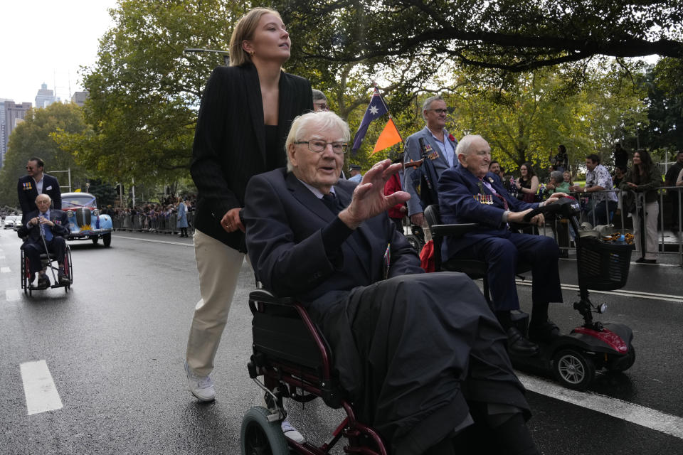 Veterans in wheelchairs take part in the Anzac Day march in Sydney, Monday, April 25, 2022. Australia and New Zealand commemorate Anzac Day every April 25, the date in 1915 when the Australia and New Zealand Army Corps landed on Turkey in an ill-fated campaign that created the soldiers' first combat of World War I. (AP Photo/Rick Rycroft)