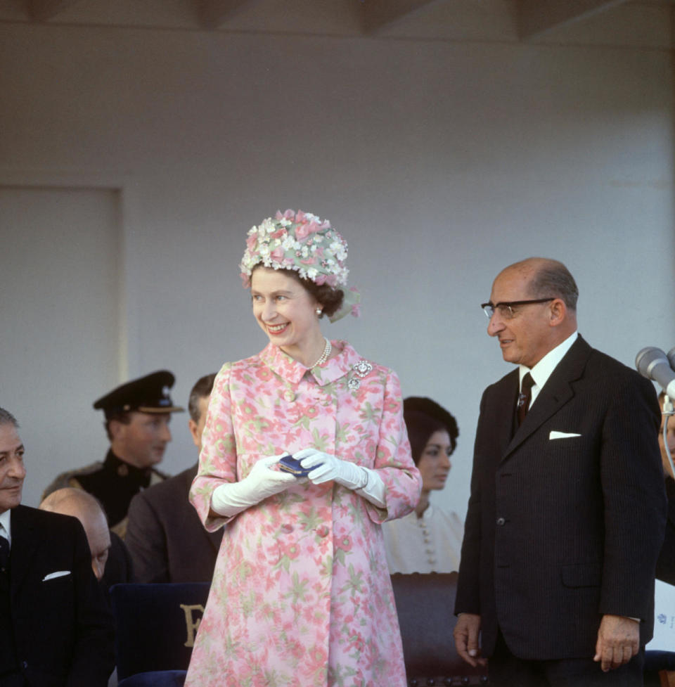 <p>We love this floral ensemble that the Queen donned during a visit to Malta in the late 60s. How excellent is that hat! <i>[Photo: Rex]</i></p>