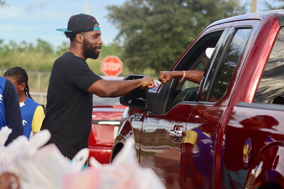 Former Arizona Cardinals wide receiver Anquan Boldin gives back to supporters at his foundation's 18th annual Thanksgiving Giveaway benefiting Boldin's hometown community of Pahokee, Florida, on Nov. 22, 2021.