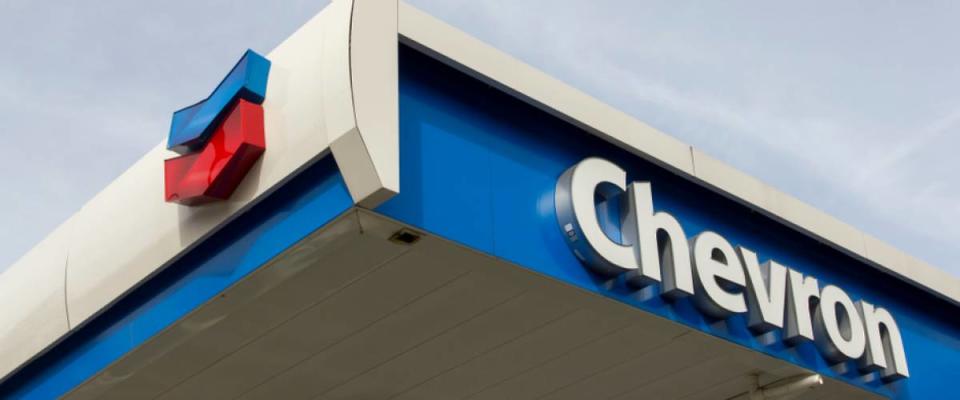 The Chevron sign at a Chevron gas station. Chevron Corporation is an American multinational energy corporation.