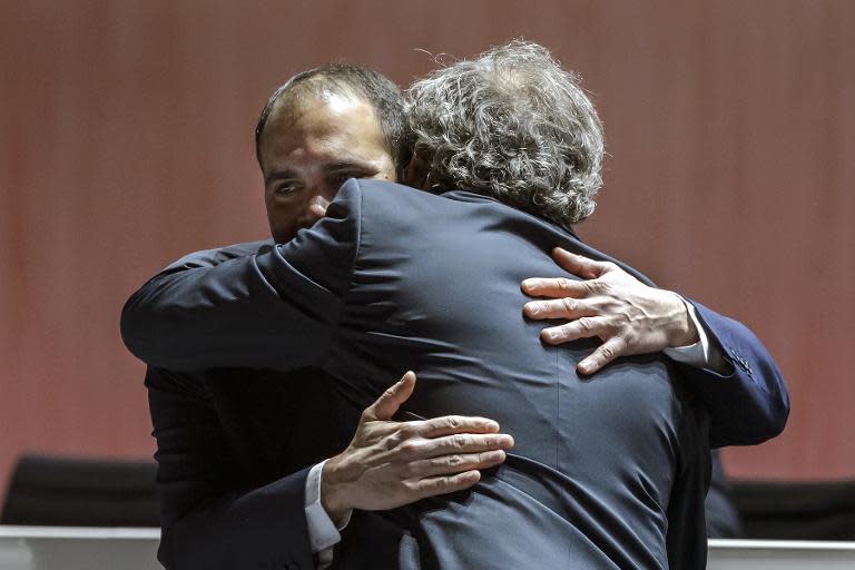 Challenger for the FIFA presidency, FIFA vice president Prince Ali bin al Hussein (L) is greeted by UEFA President Michel Platini prior to the start of the 65th FIFA Congress on May 29, 2015 in Zurich