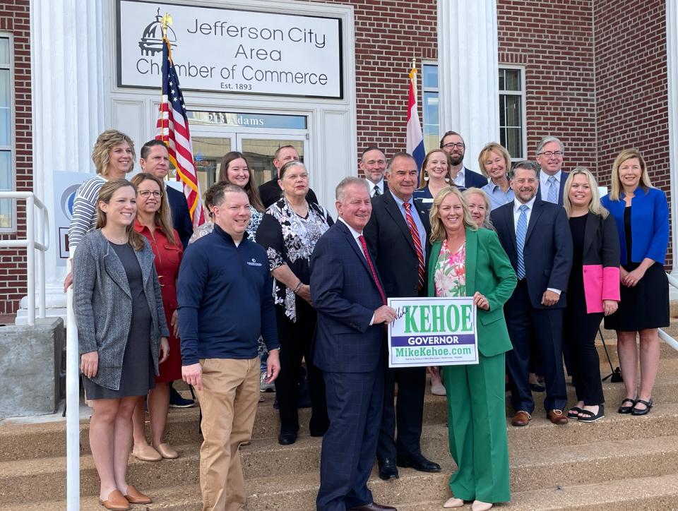 Daniel Mehan, Lt. Gov. Mike Kehoe, Claudia Kehoe pose for a photo with members of the Missouri Chamber of Commerce and Industry an event announcing the endorsement of Kehoe's 2024 gubernatorial campaign by the Missouri Chamber PAC on Sept. 12, 2023 in Jefferson City.