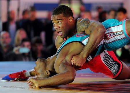 Jordan Burroughs (USA), bottom, competes with Luis Esteban Quintana Martinez (Cuba) in the men’s freestyle 74 kg/163 lbs at Times Square. Mandatory Credit: Robert Deutsch-USA TODAY Sports