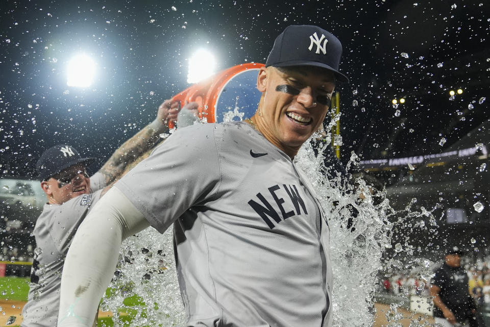 New York Yankees' Aaron Judge is doused by his teammates after he hit his 300th career home run Wednesday night. (AP Photo/Erin Hooley)