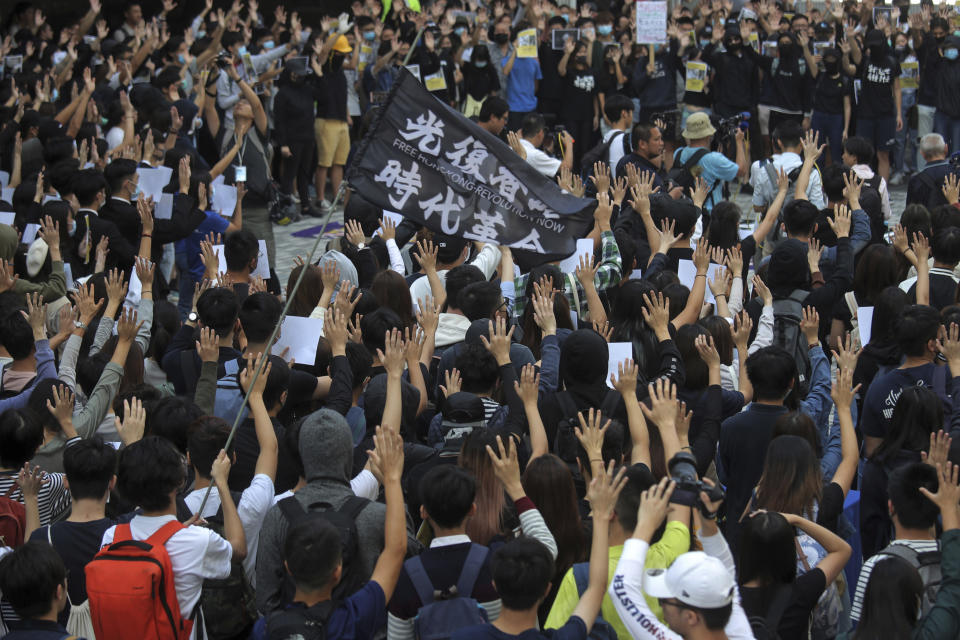 Pro-democracy university students hold up their hands to represent the protesters' five demands at the campus of the University of Hong Kong, Wednesday, Nov. 6, 2019. The protests began in early June against a now-abandoned extradition bill that would have allowed suspects to be sent for trials in mainland China, which many saw as infringing of Hong Kong's judicial freedoms and other rights that were guaranteed when the former British colony returned to China in 1997. The movement has since grown into calls for greater democracy and police accountability. (AP Photo/Kin Cheung)