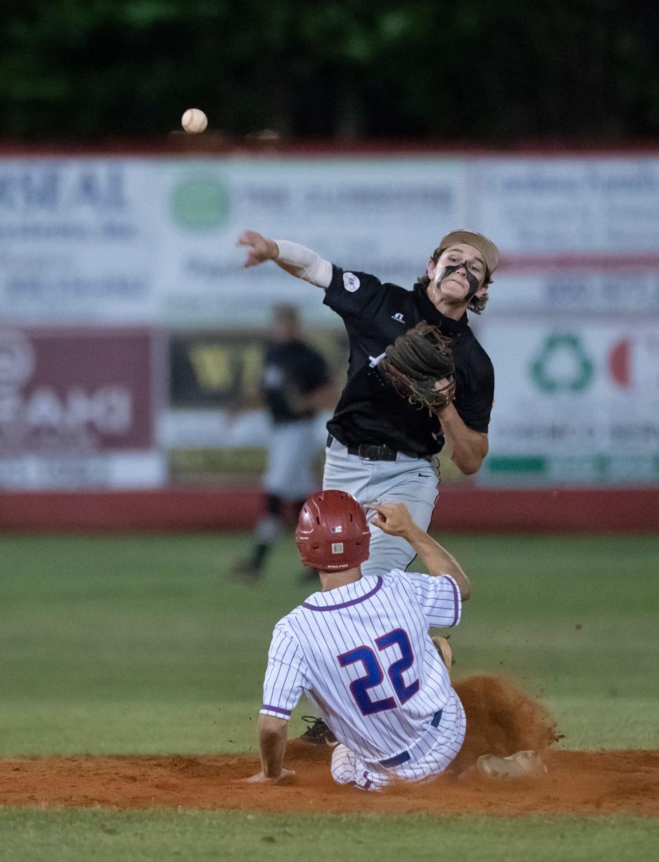 Aggies second baseman Frankie Randall (3) turns the double play to end the bottom of the 6th inning during the Tate vs Pace 6A District 1 championship baseball game at Pace High School on Thursday, May 5, 2022.
