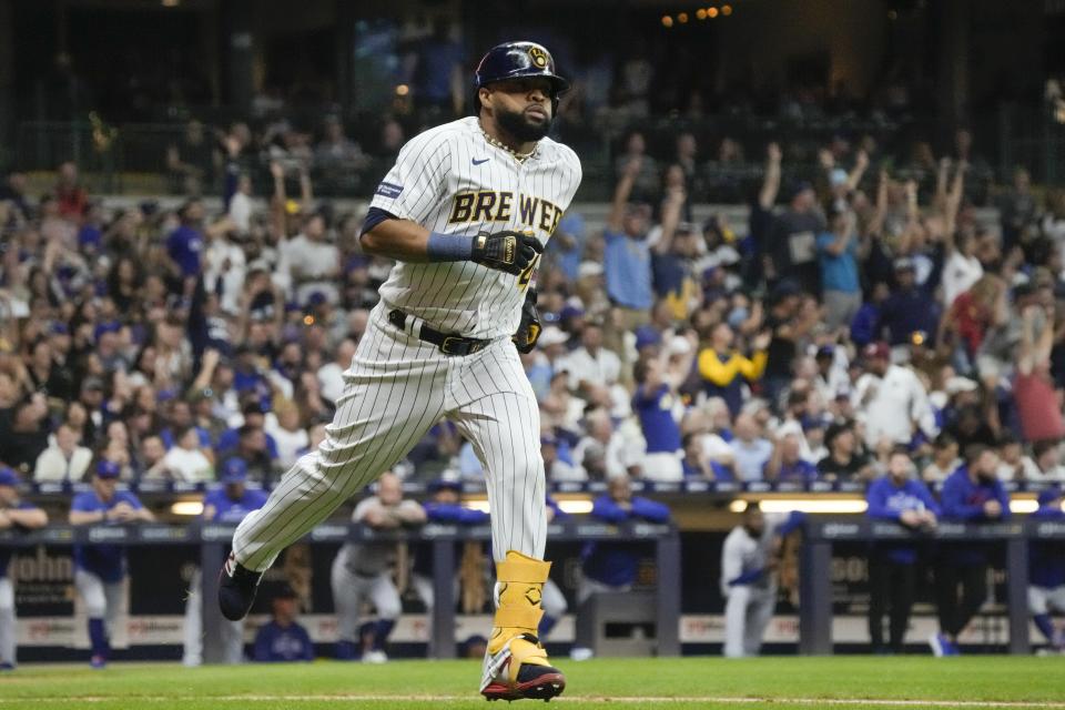 Milwaukee Brewers' Carlos Santana hits a home run during the second inning of a baseball game against the Chicago Cubs Saturday, Sept. 30, 2023, in Milwaukee. (AP Photo/Morry Gash)