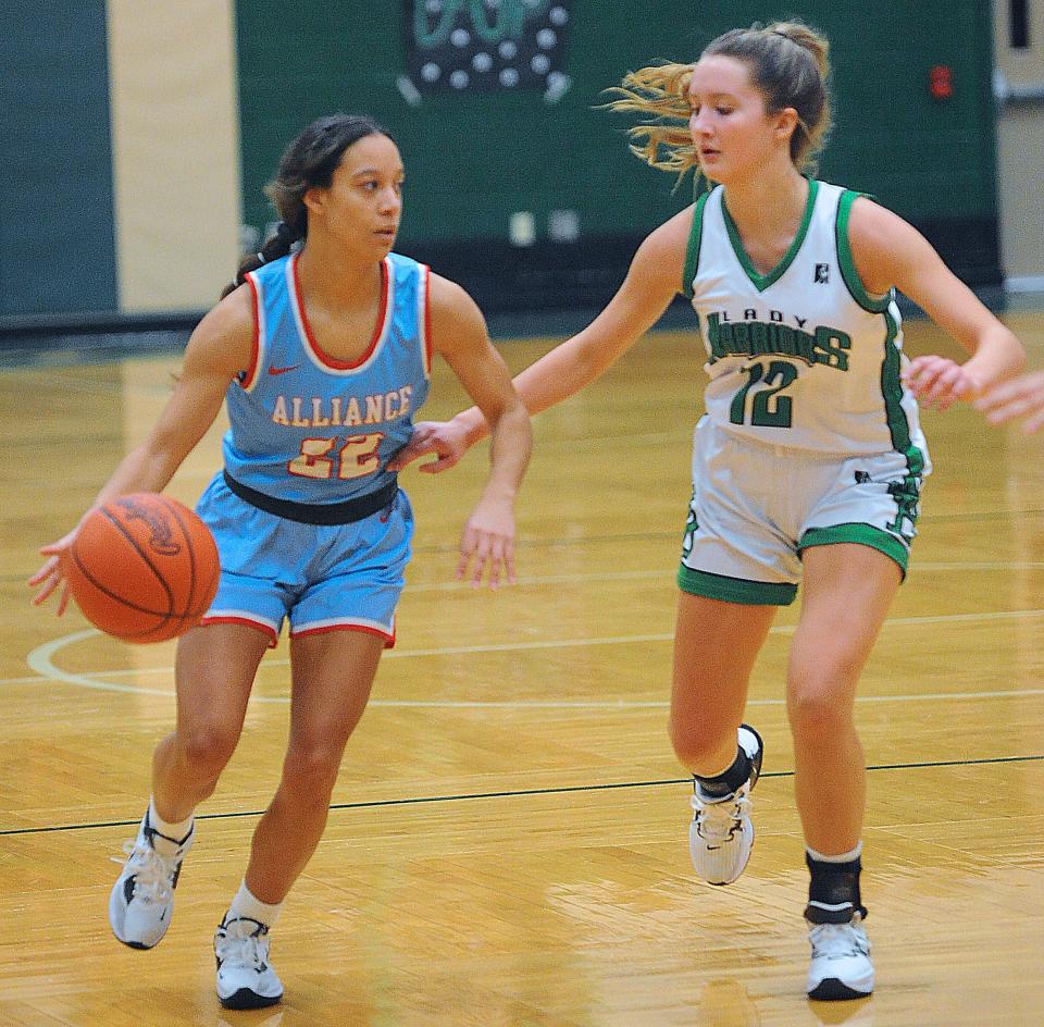 Alliance's Payton Smith is defended by West Branch's Hannah Egli in an Eastern Buckeye Conference game Wednesday, December 7, 2022 at the West Branch Field House.