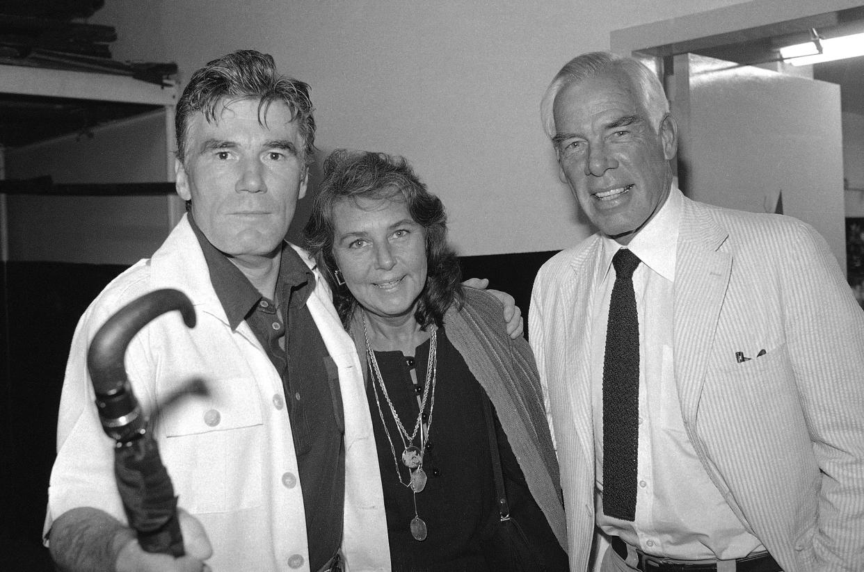 FILE - Actor Lee Marvin, right, and his wife, Pamela, visit with Mitchell Ryan, star of Arthur Miller's play "The Price," backstage at the Playhouse Theater in New York in July 1979. Ryan, who played a villainous general in the first “Lethal Weapon" movie, a ruthless businessman on TV's “Santa Barbara" and had character roles on the soap opera “Dark Shadows" and the 1990s sitcom “Dharma & Greg," died Friday, March 4, 2022. He was 88. Ryan died of congestive heart failure at his Los Angeles home, his stepdaughter, Denise Freed, told the Hollywood Reporter. (AP Photo/Dan Grossi) ORG XMIT: NYDB505