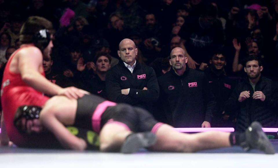 Penn State wrestling coach Cael Sanderson watches Lucas Cochran’s bout against Rutgers’ Yara Slavikouski on Monday, Feb. 12, 2024 at the Bryce Jordan Center.