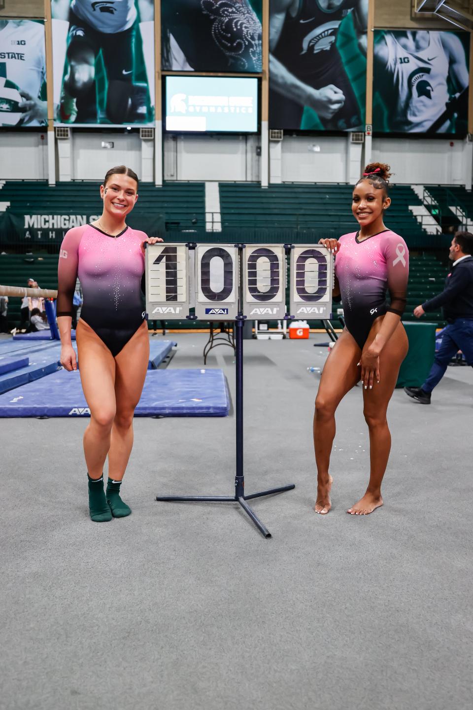 Jori Jackard and Nikki Smith pose after MSU's win over Bowling Green and Long Island University this season, when the Spartans broke the MSU team record for a meet score with a 198.225