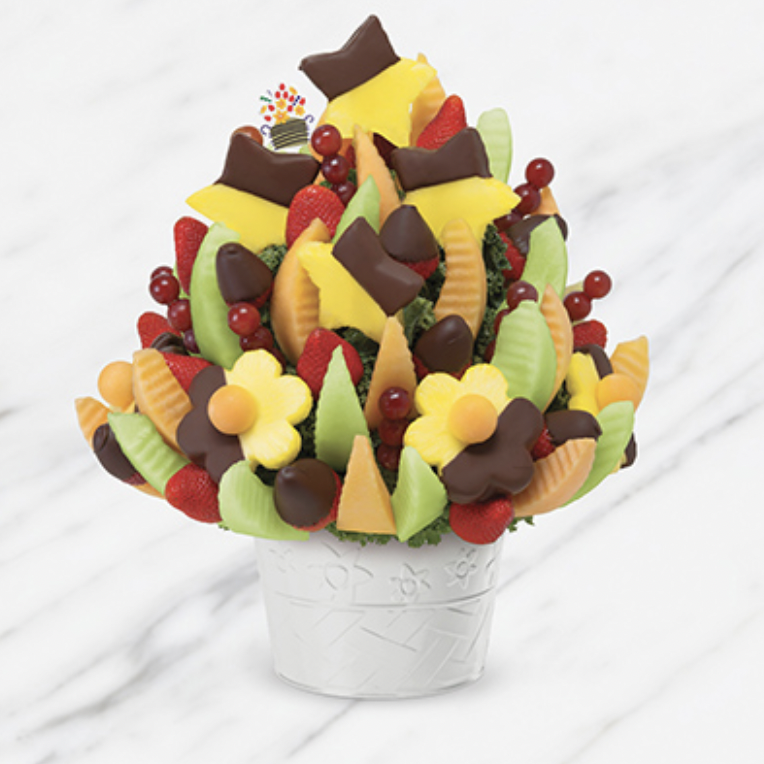 <p><a href="https://go.redirectingat.com?id=74968X1596630&url=https%3A%2F%2Fwww.ediblearrangements.com%2Ffruit-gifts%2Fdelicious-celebration-dipped-strawberries-pineapple-1260%3Ft%3D1661365219647%26ArrangementGroupID%3D634&sref=https%3A%2F%2Fwww.thepioneerwoman.com%2Ffood-cooking%2Fg38290860%2Fchristmas-gift-baskets%2F" rel="nofollow noopener" target="_blank" data-ylk="slk:Shop Now;elm:context_link;itc:0;sec:content-canvas" class="link rapid-noclick-resp">Shop Now</a></p><p>Delicious Celebration Dipped Strawberries & Pineapple</p><p>ediblearrangements.com</p><p>$111.99</p><span class="copyright">Edible Arrangements </span>