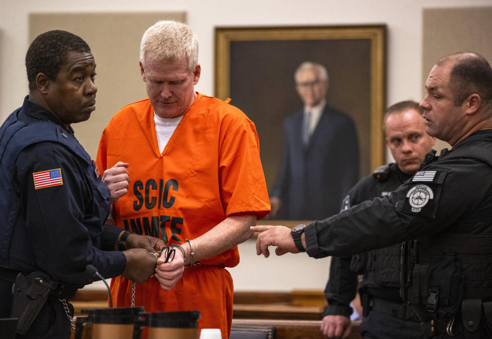 Alex Murdaugh's handcuffed are removed as he addresses the court during his sentencing for stealing from 18 clients, Tuesday, Nov. 28, 2023, at the Beaufort County Courthouse in Beaufort, S.C. (Andrew J. Whitaker/The Post And Courier via AP, Pool)