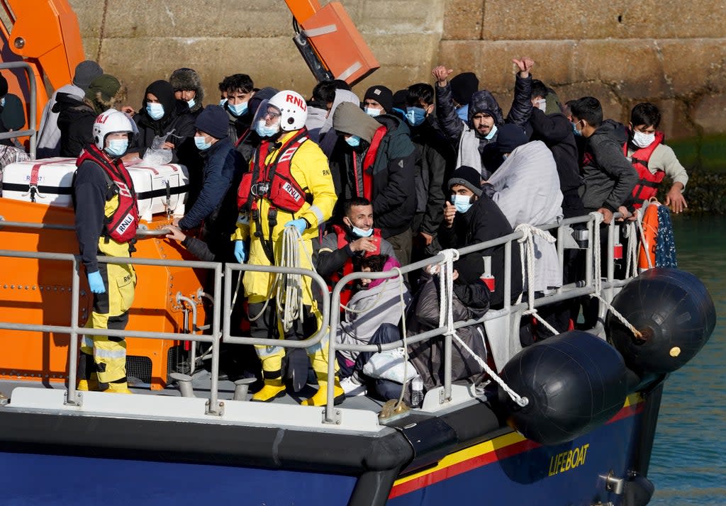 A group of people thought to be migrants are brought into Dover (PA) (PA Wire)