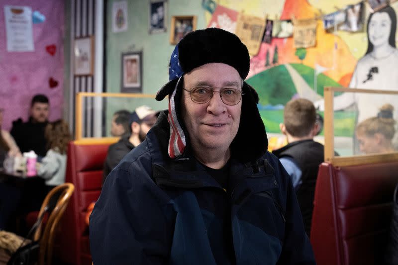 Dave Brummel poses for a portrait as he has having breakfast in a cafe, in Des Moines