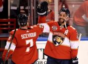 Jan 18, 2019; Sunrise, FL, USA; Florida Panthers center Vincent Trocheck (right) celebrates with center Colton Sceviour (left) after defeating the Toronto Maple Leafs during the third period at BB&T Center. Mandatory Credit: Steve Mitchell-USA TODAY Sports