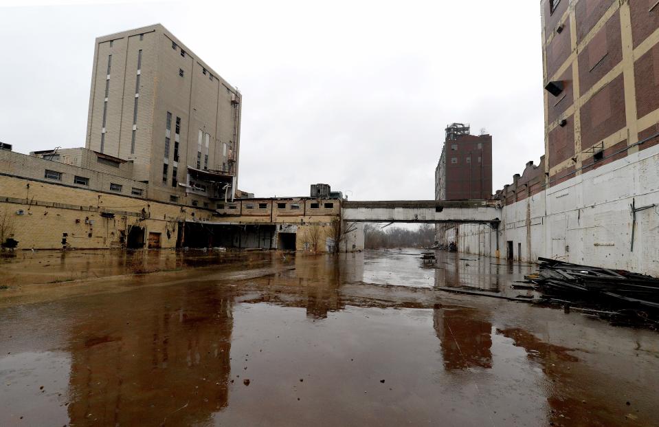 The bakery mix tower, left, and B cell warehouse, right, at the old Pillsbury Mills Wednesday March 30, 2022. [Thomas J. Turney/ The State Journal-Register]