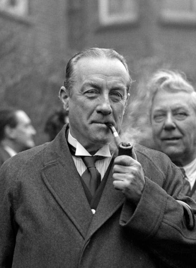 Stanley Baldwin smoking a pipe