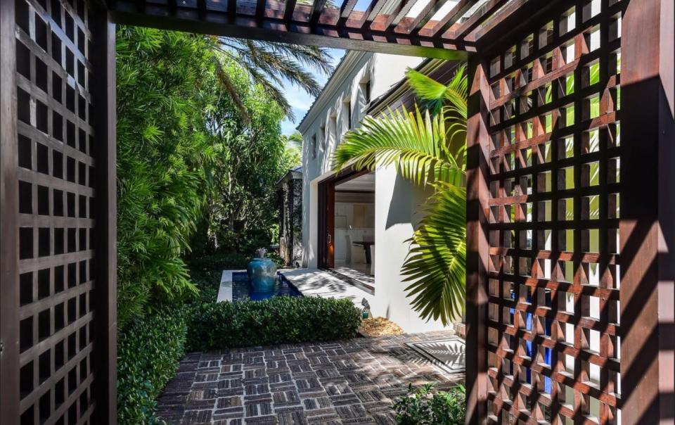 A garden area with a water feature at 309 Garden Road is seen in a photo taken around the time Jimmy and Jane Buffett sold the Palm Beach house for $6.9 million in 2020.