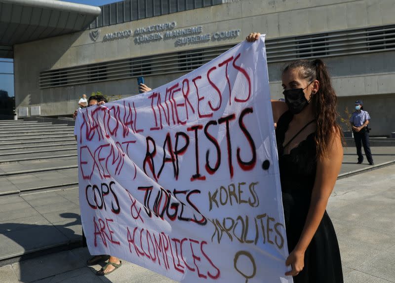 Activists take part in a demonstration supporting a British woman who says she was pressured into retracting a claim of gang rape, outside the Supreme court in Nicosia