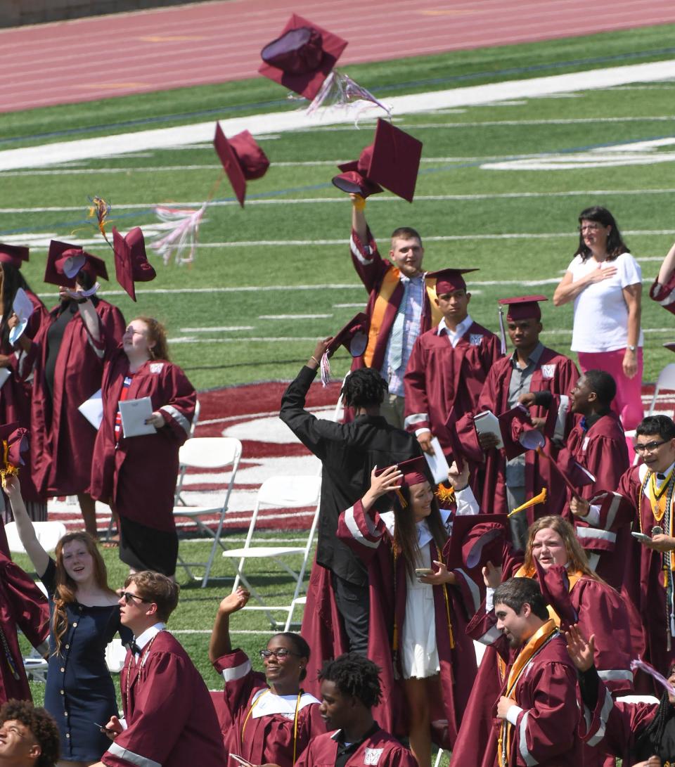 Graduates toss their caps during Westside High School commencement in Anderson, S.C. Thursday, June 4, 2020. 