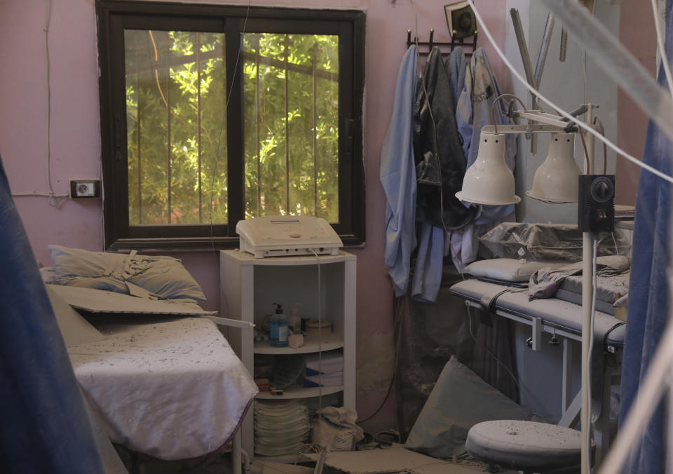 A heavily damaged hospital is seen in the city of Afrin, Syria, Sunday, June 13, 2021. Shells have hit the hospital Saturday, killing at least 13 people, including two medical staff and two ambulance drivers. It was not immediately clear who was behind the shelling, which came from areas where government troops and Kurdish-led fighters are deployed. (AP Photo/Ghaith Alsayed)