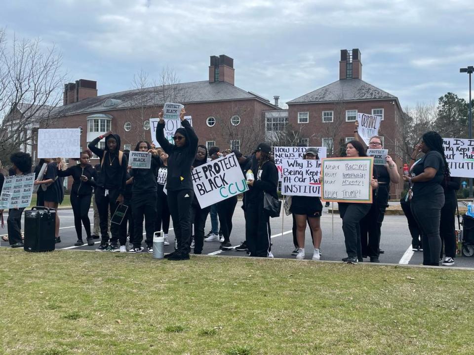 Coastal Carolina University students dressed in black are protesting the Trump rally on Saturday, Feb. 10, 2024. The students said they are upset because the university didn’t give students advanced notice of the rally. Ben Morse/bmorse@thesunnews.com