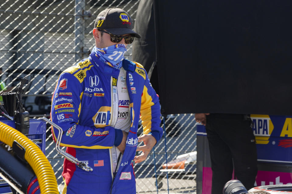 Alexander Rossi prepares to drive before practice for the Indianapolis 500 auto race at Indianapolis Motor Speedway in Indianapolis, Friday, Aug. 21, 2020. The 104th running of the Indianapolis 500 auto race is scheduled to run on Sunday. (AP Photo/Michael Conroy)