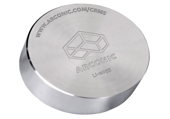 Metal cylinder with Arconic logo and information engraved on it.